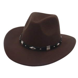 Detail of dark brown cowboy felt hat featuring black decorative band with silver metal studs