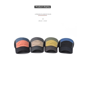 Detail of color-block cotton baseball caps in four multi-color combinations on white