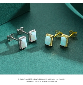 Close-up of S925 sterling silver opal stud earrings in gold and silver finishes