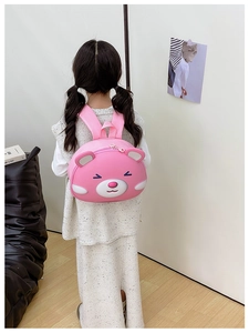 Toddler girl wearing pink cartoon bear hard shell backpack with wide straps