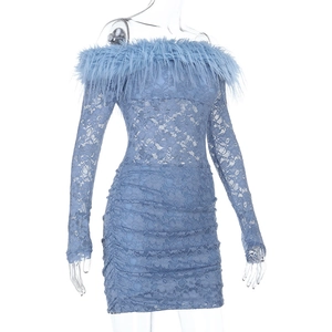 Close-up of light blue lace dress featuring feathered neckline and pleated texture