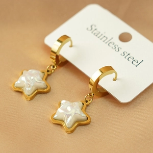 Elegant gold stainless steel star earrings with pearlescent white center on silk