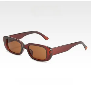 Detail view of vintage square sunglasses with translucent amber brown frames and lenses