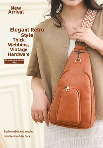 Detail of vintage brown PU leather crossbody bag with patterned woven strap and retro hardware