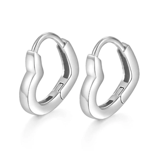 Detailed view of 925 silver heart shaped hoop earrings with polished metallic surface