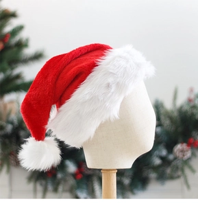 Detail view of the plush red and white Santa hat on a mannequin with a Christmas background