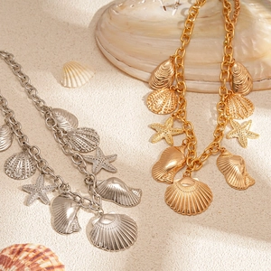 Seaside vacation style metallic starfish and scallop shell necklace set in gold and silver