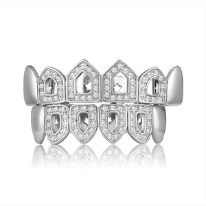 Silver iced out hip hop grillz set with sparkling zircon stones on white background