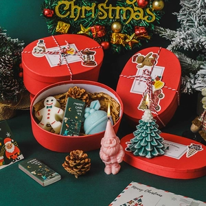 Christmas scented candle gift set with gingerbread man, tree, and Santa shaped candles