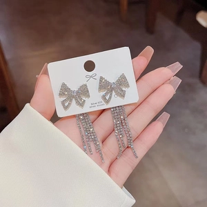 Elegant silver bow tassel earrings with sparkling rhinestones and S925 silver needles