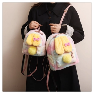 Detail of plush rainbow gradient bunny backpacks with soft faux fur and cute rabbit ears