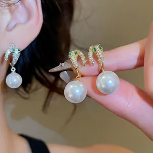 Luxury 14K gold plated pearl earrings with green emerald accents and sparkling zircon stones