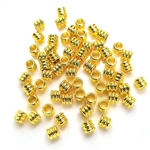 14k gold-filled threaded barrel beads for DIY jewelry making on white background