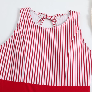 Detail of red and white striped bikini top with a chic tie-back bow and paneled design