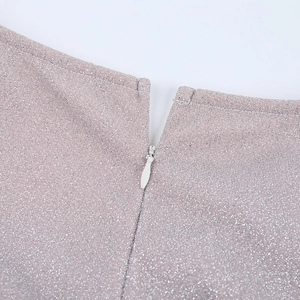 Macro shot of silver pink glitter fabric with a high-quality invisible zipper closure