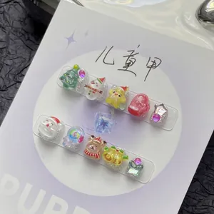 Handmade 3D Christmas press-on nails set for kids featuring Santa and Reindeer designs