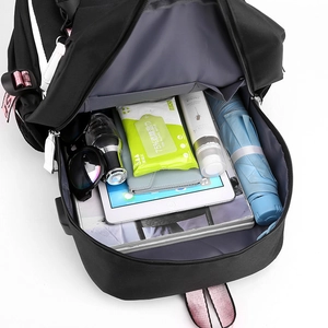Minimalist black backpack showing spacious interior with iPad and daily essentials