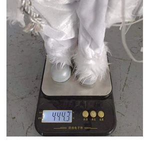 Detail shot showing the actual weight of 444.3g for the white plush Santa Claus doll