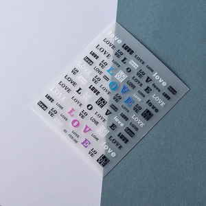 Macro detail of 5D embossed nail stickers featuring various artistic LOVE lettering styles