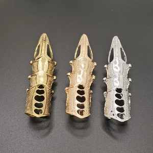 Gothic punk joint rings in bronze, gold, and silver finishes with hollow patterns