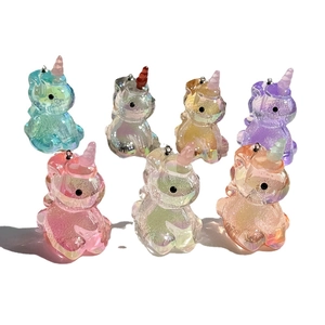 Colorful acrylic unicorn charms with iridescent glitter in various vibrant shades