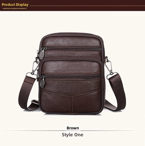 Close-up of coffee brown leather messenger bag with multiple zip compartments and texture