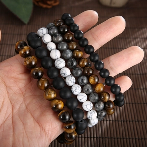 Men's beaded bracelet set with tiger eye and agate featuring skull and cross charms