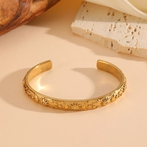Vintage gold celestial cuff bracelet featuring sun moon and star motifs with rhinestones