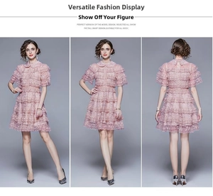 Detail of the pink tiered lace dress showing the exquisite layered ruffles and high waist