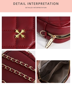 Detail view of red quilted cross-body bag with gold hardware and chain strap