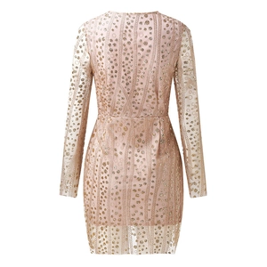 Detail view of champagne gold sequin dress back with hidden zipper and fine embroidery