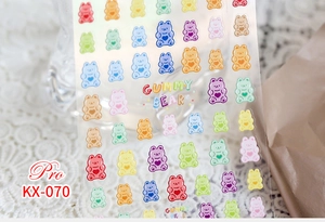 Detailed macro view of colorful gummy bear nail art stickers with heart motifs