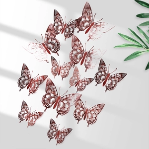 Detailed view of 12 rose gold 3D hollow butterfly wall stickers with intricate patterns