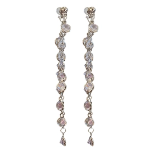 Long silver tassel earrings with round cubic zirconia pendants in a vertical style
