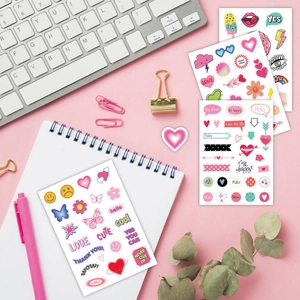 Set of 6 cute colorful cartoon stickers for DIY journals on a pink lifestyle desk