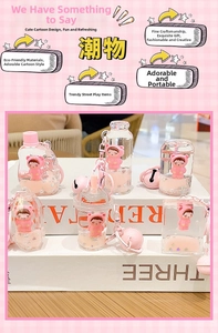 Pink cartoon bear liquid quicksand keychain charms in diverse bottle shapes with bells