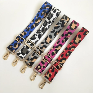 Detail view of five leopard print shoulder straps with gold-plated swivel lobster clasps