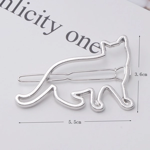 Detail view of cat silhouette metal hair clip in silver finish with size markings