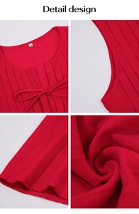 Detail view of the red sleeveless dress showing pleated texture and tie neckline design