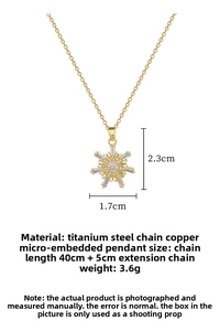 Detail of gold snowflake necklace with micro-pave crystals and titanium steel chain