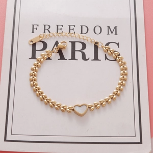 Golden titanium steel heart pendant bracelet with leaf-shaped links and shell inlay