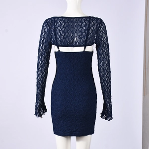 Detail view of the lace texture and back design of a navy blue two-piece mini dress