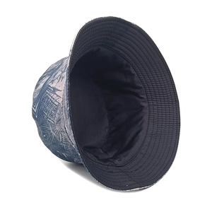 Reversible bucket hat with retro palm leaf print and plain black interior design