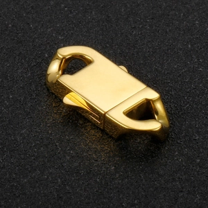 Macro detail of a golden stainless steel spring clasp for high-end jewelry DIY accessories