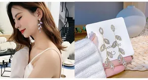 Detail of silver leaf drop earrings with sparkling rhinestones on an elegant model