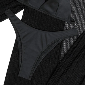 Close-up of black high-waisted bikini bottoms showing elastic fabric and stitching details