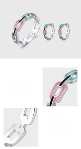 Macro detail of S925 sterling silver interlocking rings with colorful enamel inlay