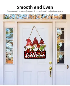 Close-up of wooden Christmas gnome welcome sign hanging on a white front door