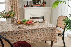 Macro detail of gingerbread and snowflake prints on textured cotton linen tablecloth