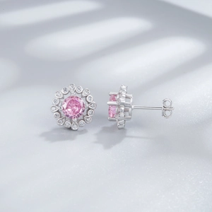 Luxurious S925 silver stud earrings featuring pink gemstone centers and floral zircon halos
